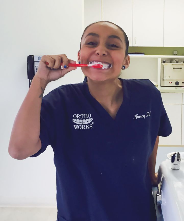 Staff Member Brushing Teeth